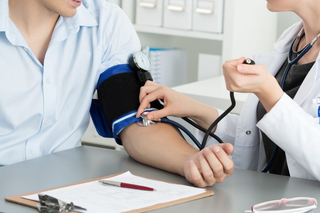 female medicine doctor measuring blood pressure patient medical healthcare concept